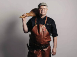 Mill Castlemaine Oakwood Smallgoods Ralf with ham leg on shoulder prof pic uai